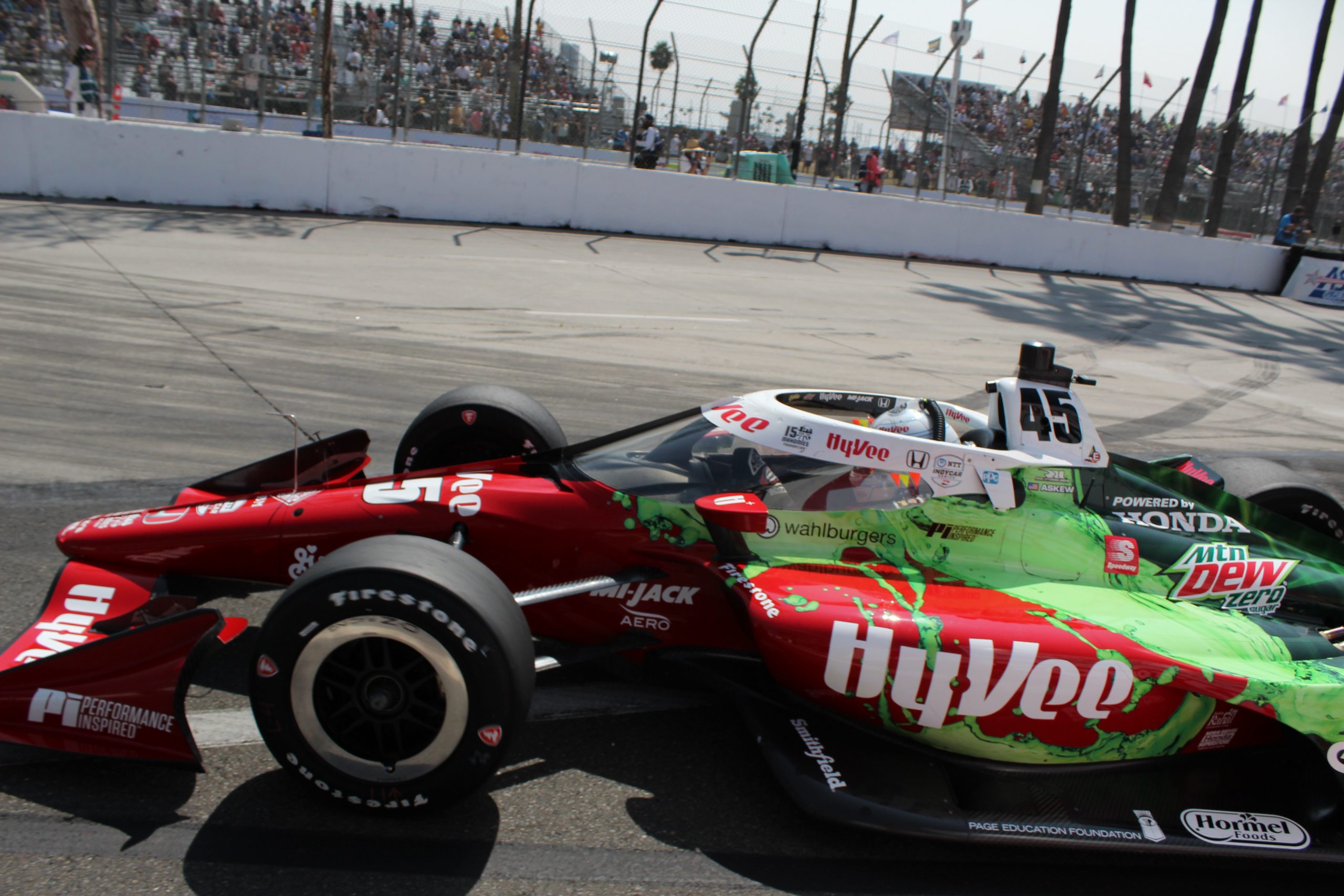 With the advent of wraps for race cars these days, the Rahal Letterman Lanigan team gives Oliver Askew one of the most intricate and colorful sponsor liveries of any car on the grid. Here Askew prepares to muscle his way through the Turn 11 hairpin.