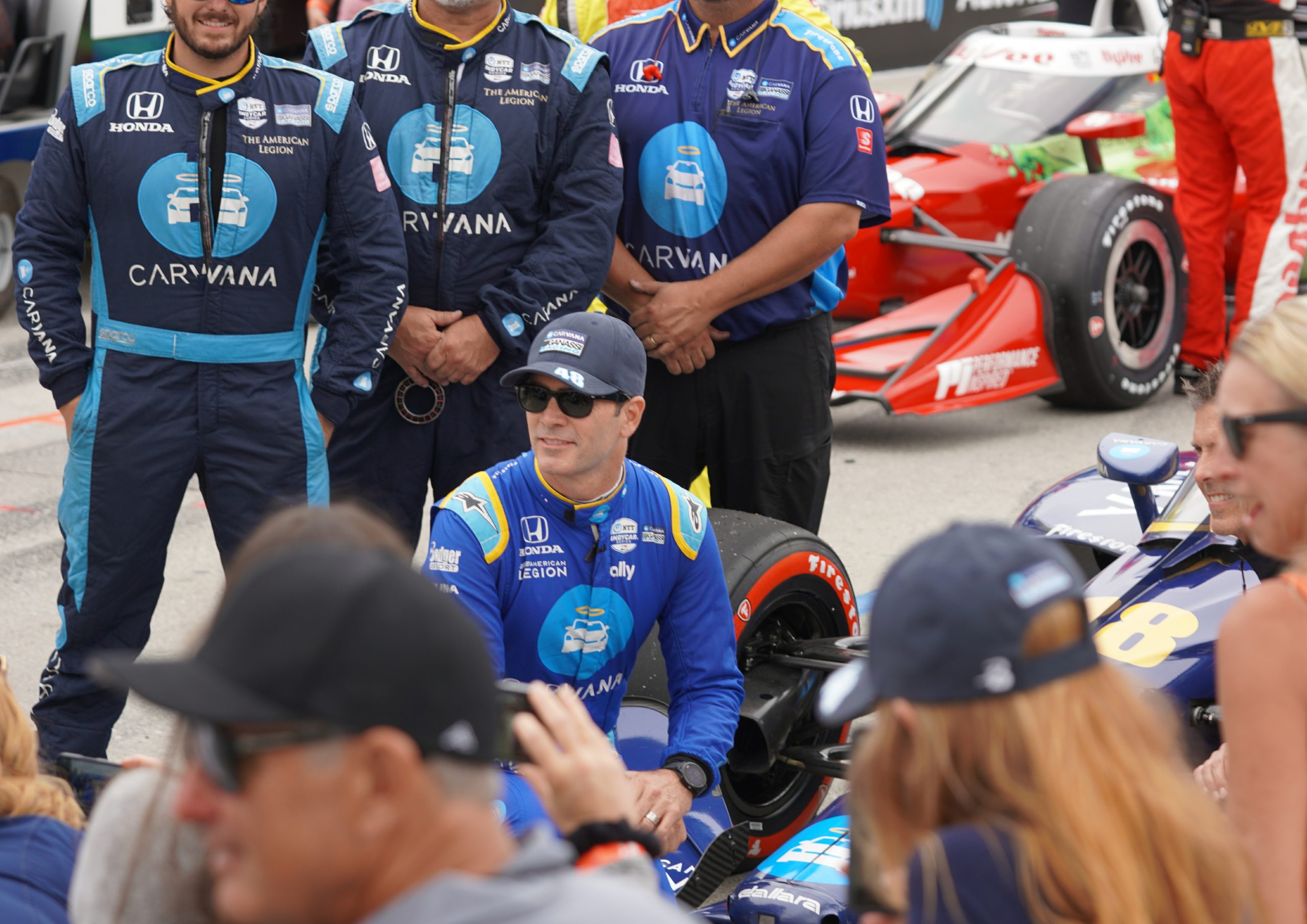 Jimmie Johnson poses for a photo with his crew behind him (and driver coach Scott Pruett flanking him on his left) on Shoreline Drive just minutes before the Acura Grand Prix of Long Beach.